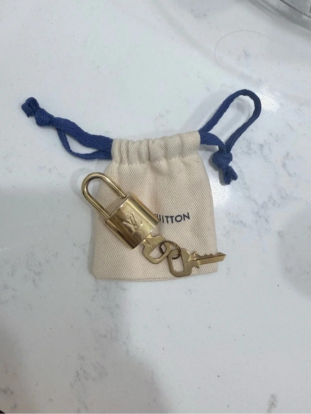 Louis Vuitton Gold Padlock Key Charm with Cream Pouch and Blue Drawstrings